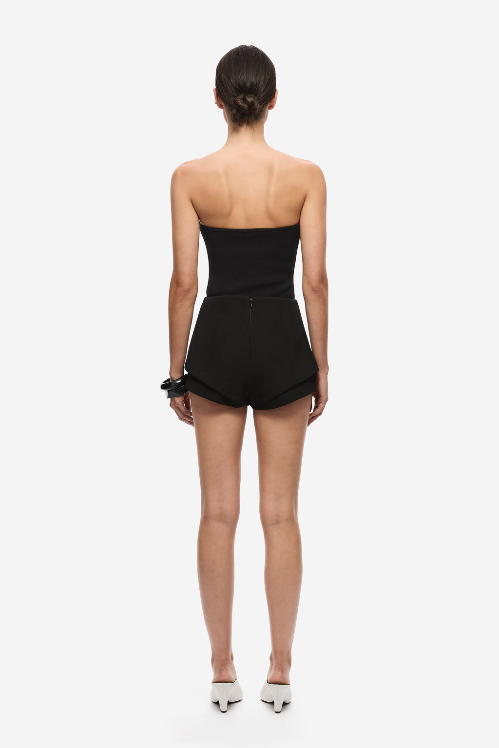 Black strapless knit bodysuit, back view with high-waist short bottoms