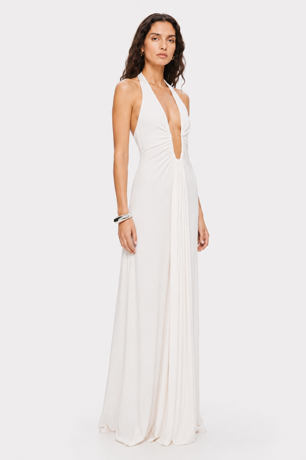 Ivory sleeveless maxi dress with deep V front and flowing pleated skirt