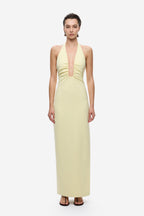 Lemon yellow halter maxi dress with deep V-neck and circular neckline cutout