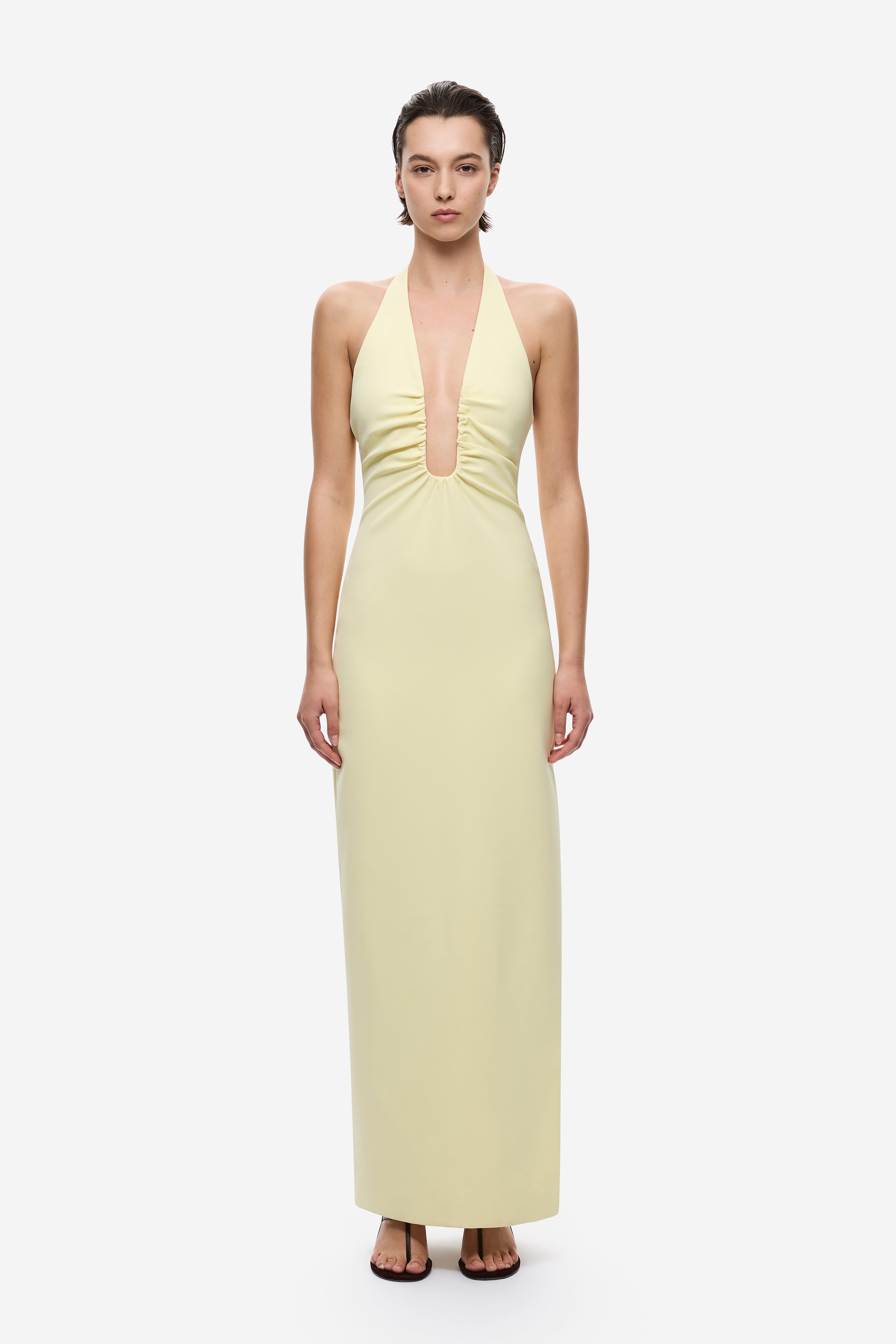Lemon yellow halter maxi dress with deep V-neck and circular neckline cutout
