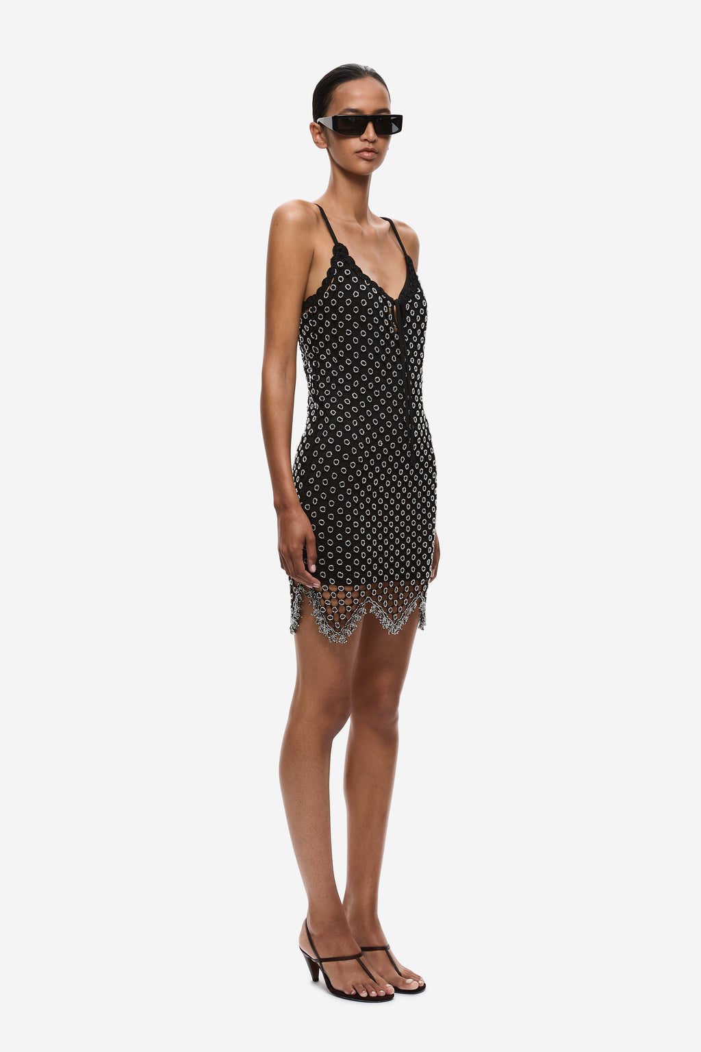 Black beaded crochet mini dress, sleeveless spaghetti straps, V-neck and beaded fringe hem