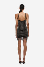 Back view of black beaded crochet mini dress with spaghetti straps and open back