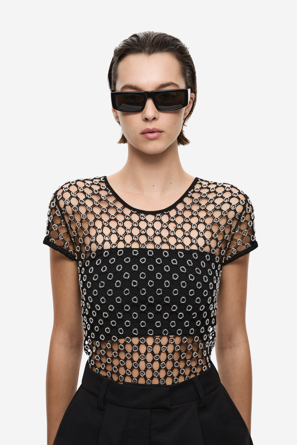Black beaded crochet cropped tee close-up, round neck, chain-and-dot pattern.