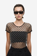 Black beaded crochet cropped tee close-up, round neck, chain-and-dot pattern.