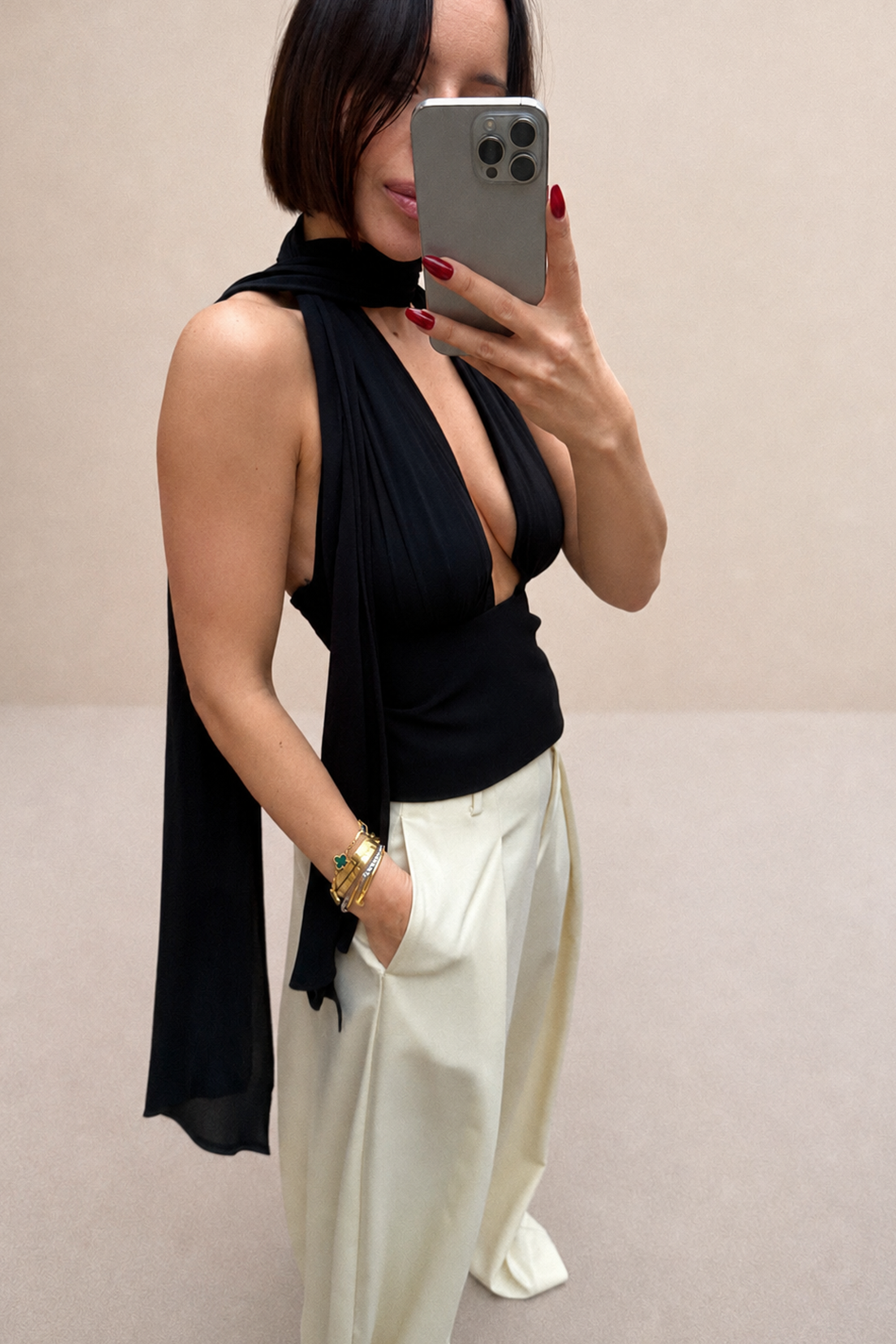 Black silk halter top with scarf-like neck drape and open V neckline