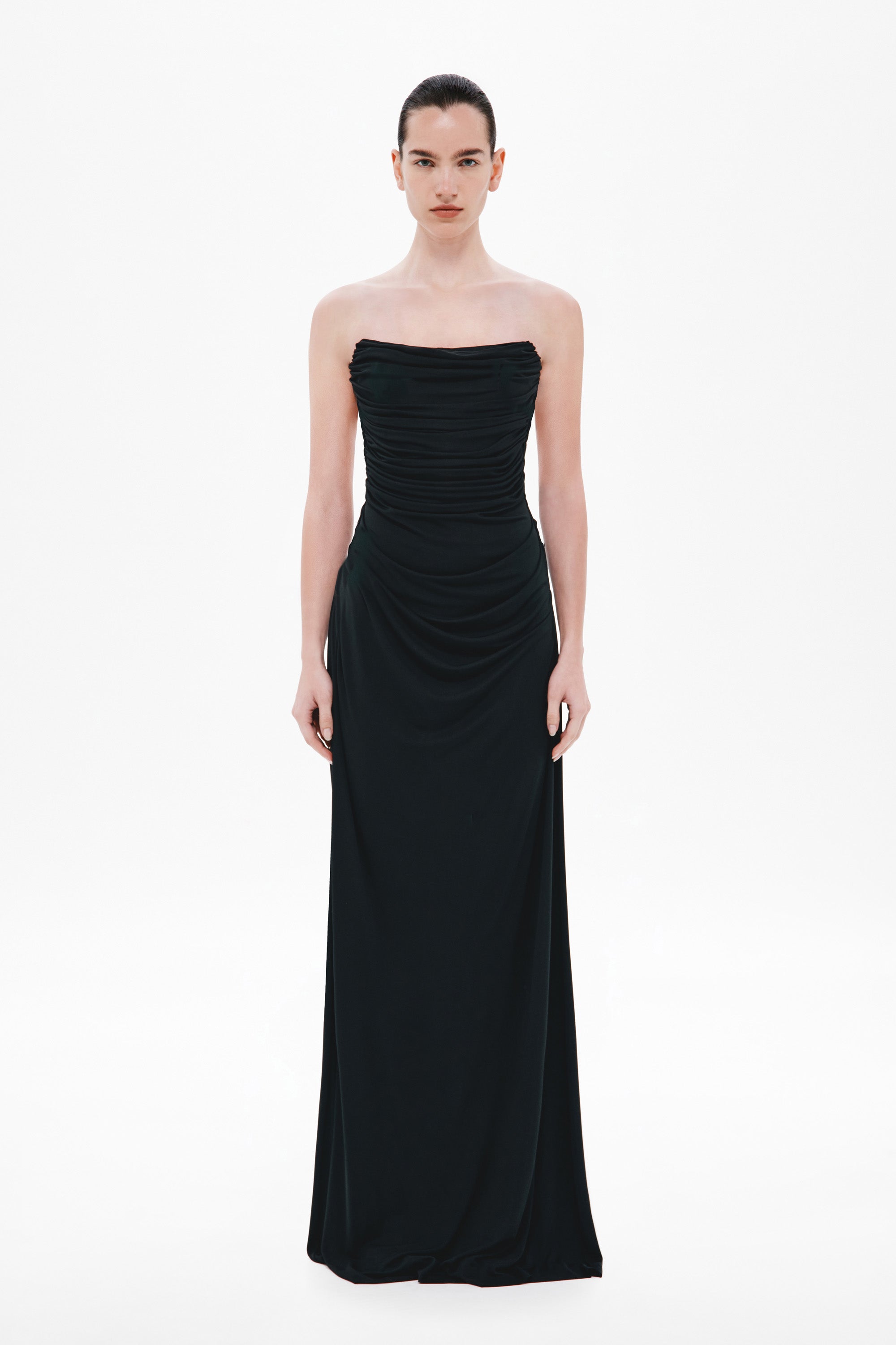 Black draped strapless maxi dress with ruched bodice and fitted waist