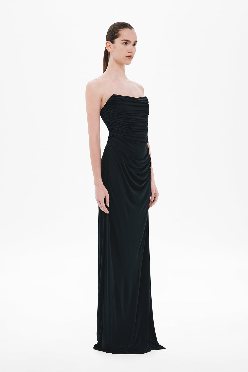 Black strapless draped maxi dress with soft side gathers at the waist