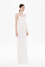 White draped strapless maxi dress with gathered waist and column skirt