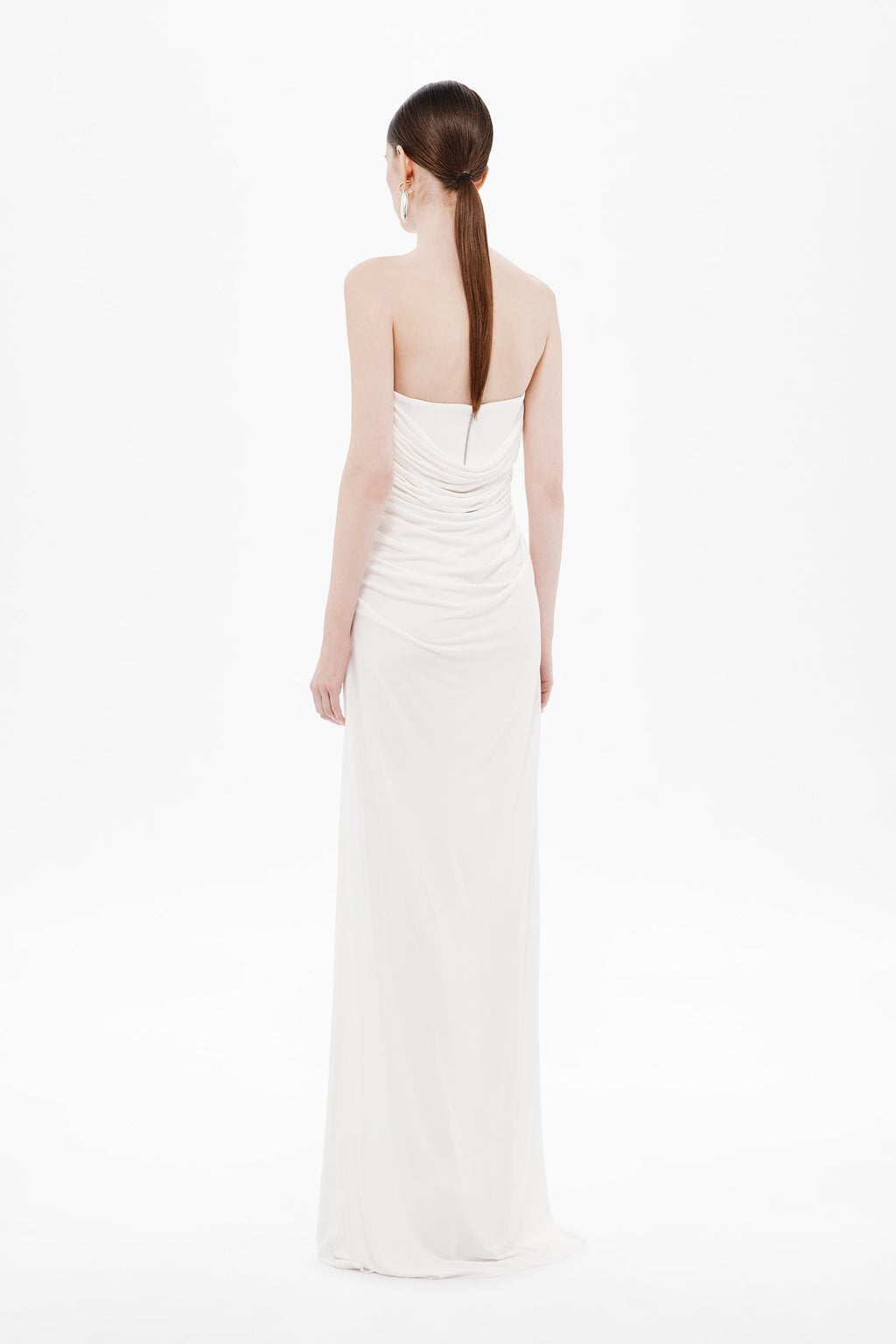 Backless white draped jersey maxi dress with narrow straps and ruched back