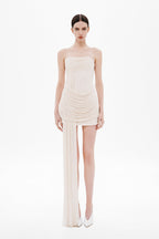 Strapless wrapped mini dress in whisper white with ruched draping and thigh slit