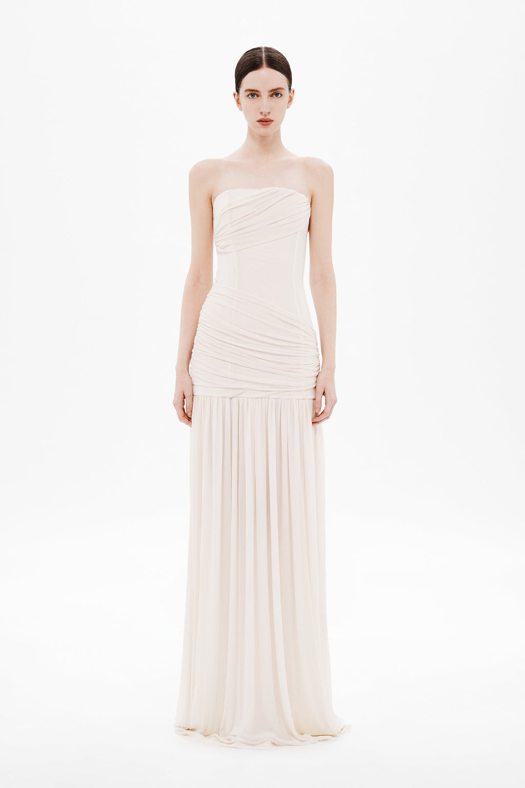 Whisper white strapless wrapped maxi dress on model, ruched bodice and tiered skirt