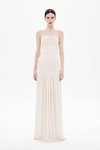 Whisper white strapless wrapped maxi dress on model, ruched bodice and tiered skirt