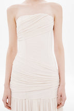 Whisper white strapless wrapped maxi dress close-up, ruched bodice and pleated tiers
