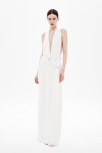Ivory sleeveless satin wrap dress with deep V neckline and adjustable tie