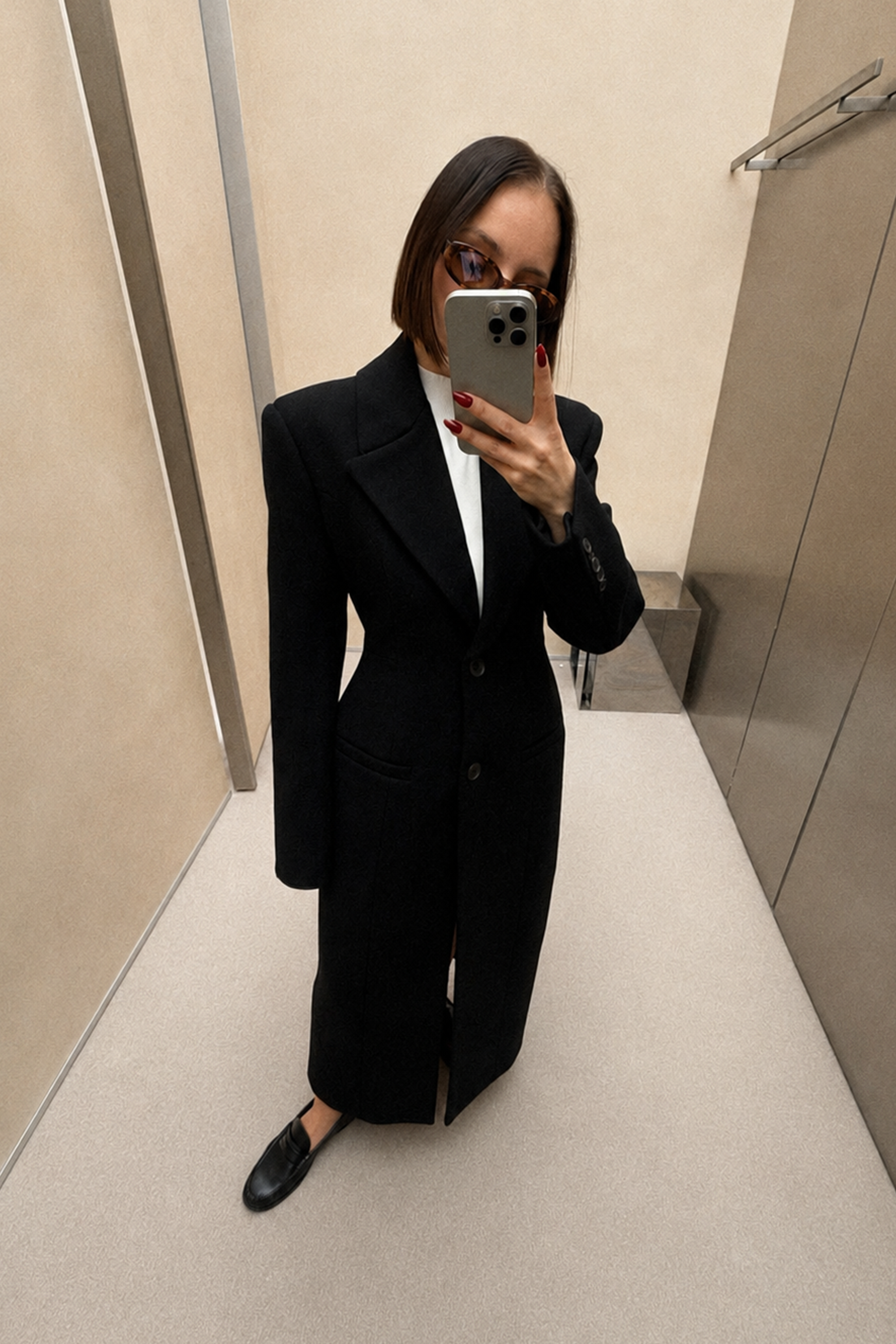 Black long coat with wide lapels and single-breasted button front