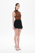 Black bubble mini skirt, side view, elastic waistband with gathered pleats