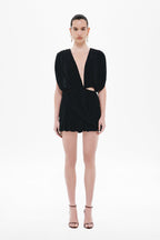 Black jersey mini wrap dress with short puff sleeves and ruffled hem
