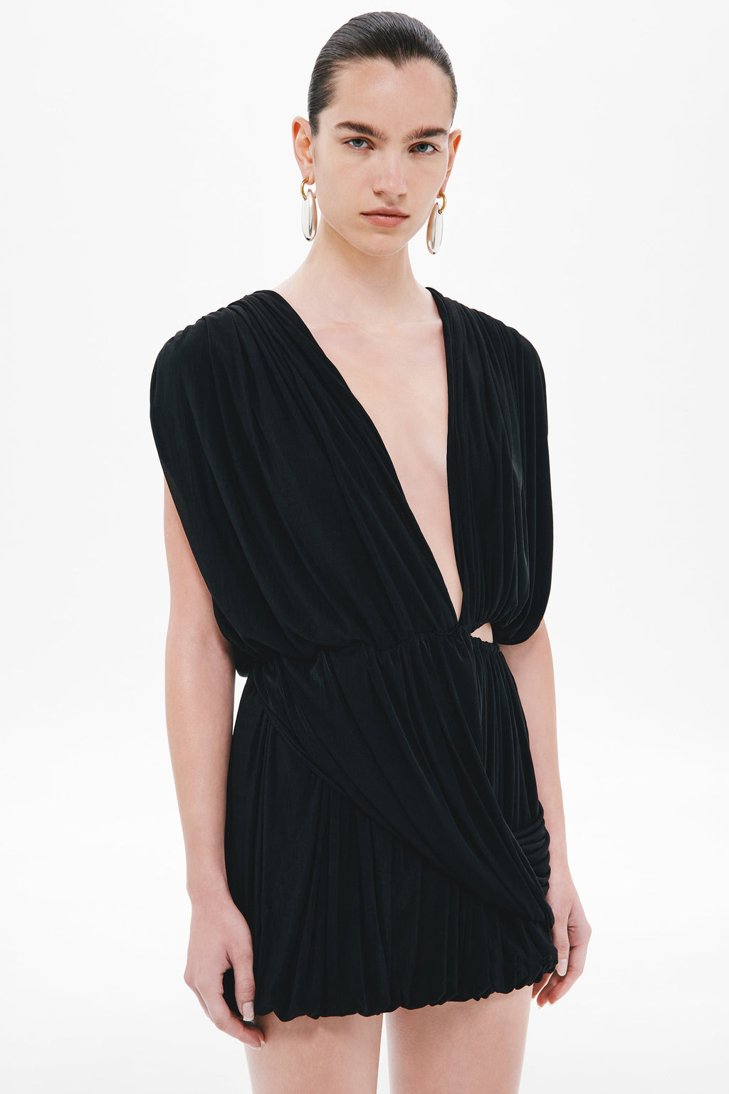 Black mini wrap jersey dress with V neckline, draped bodice, and gathered skirt