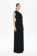 Black sleeveless one-shoulder maxi dress with diagonal drape and long pleated body