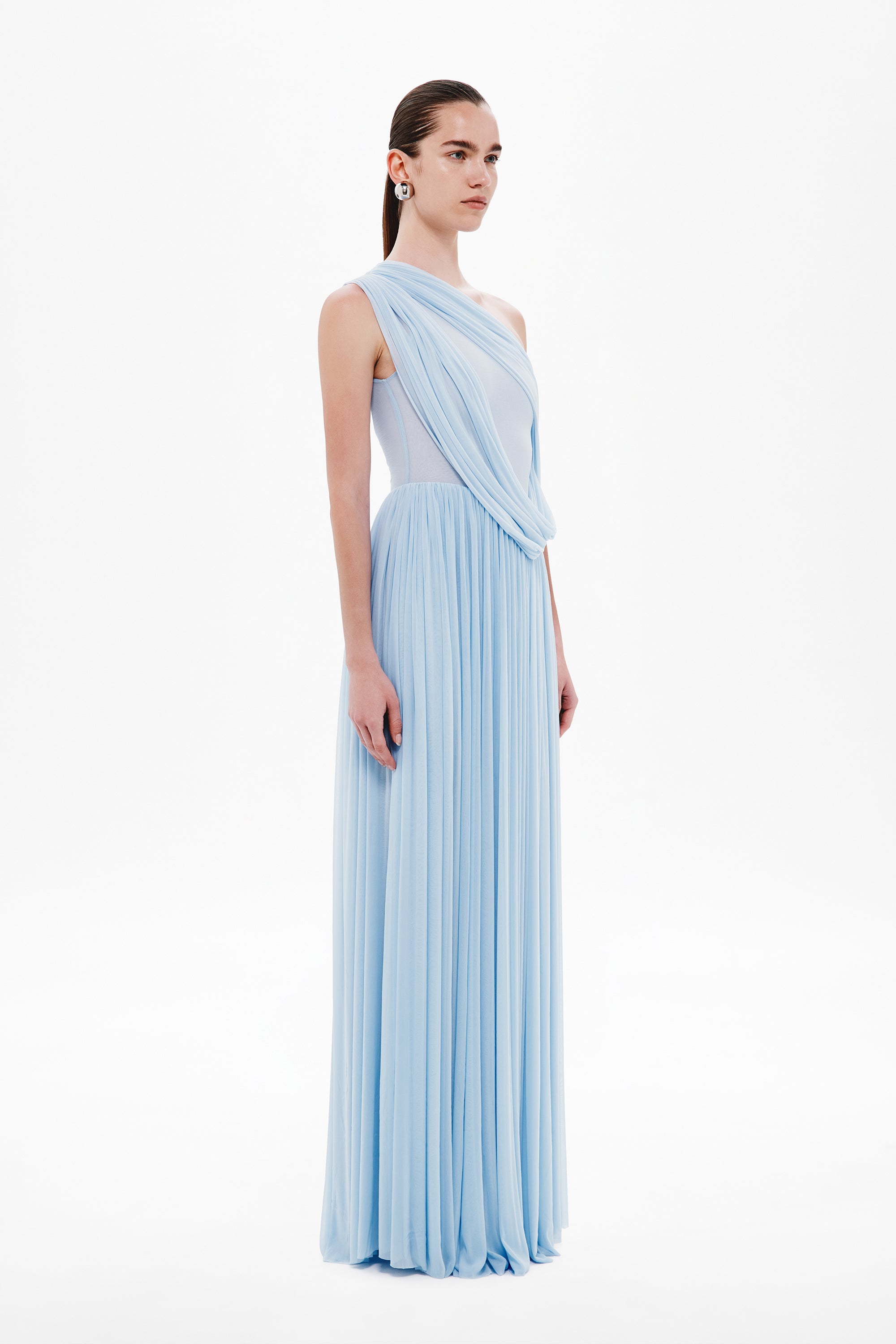 Cornflower one-shoulder pleated maxi dress with cowl-like neckline and flowing drape
