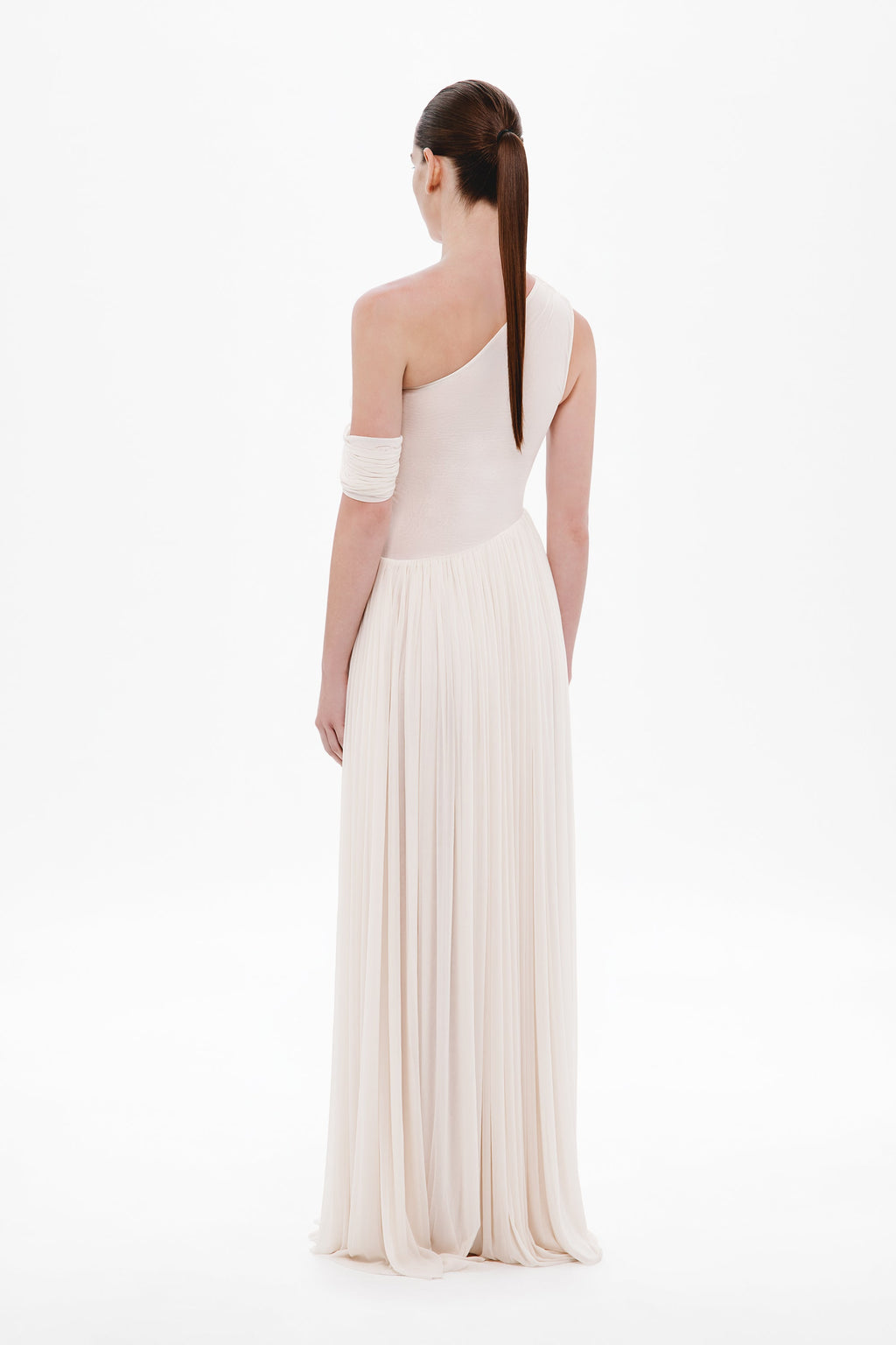 Whisper white backless one-shoulder maxi dress with draped strap and pleated skirt