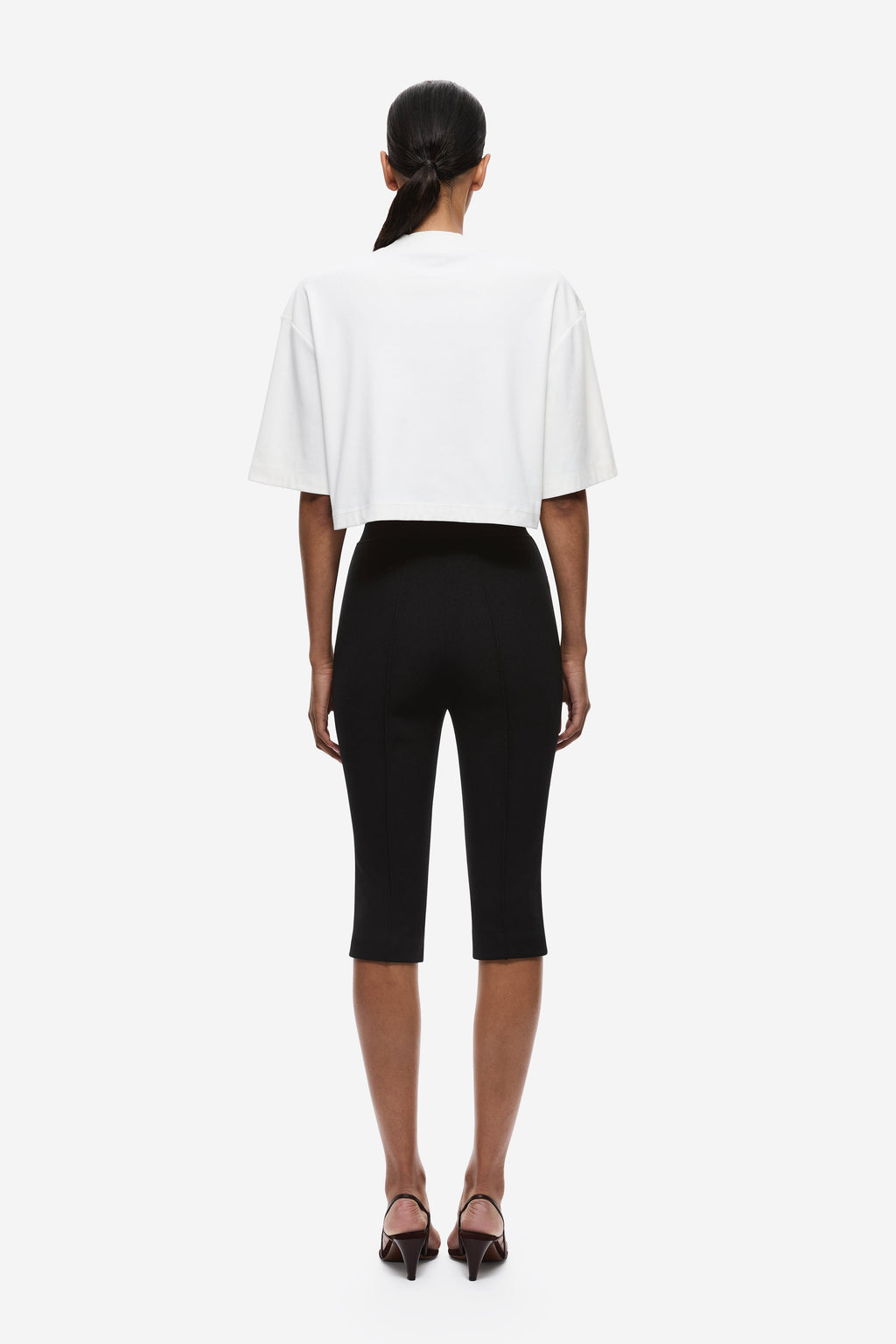Back view of ivory oversized cropped T-shirt with short sleeves