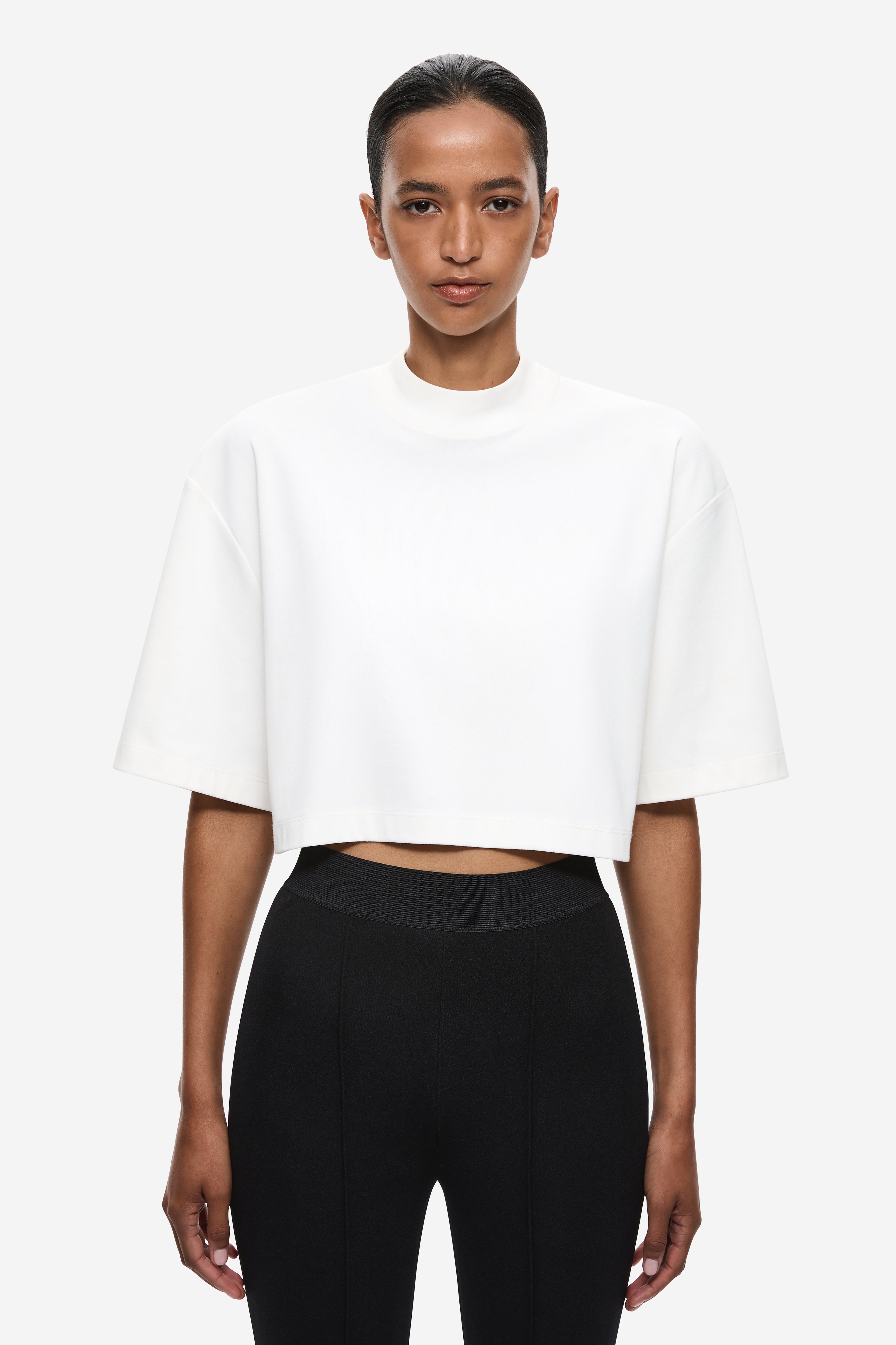 Front view of ivory oversized cropped T-shirt with crew neck and short sleeves