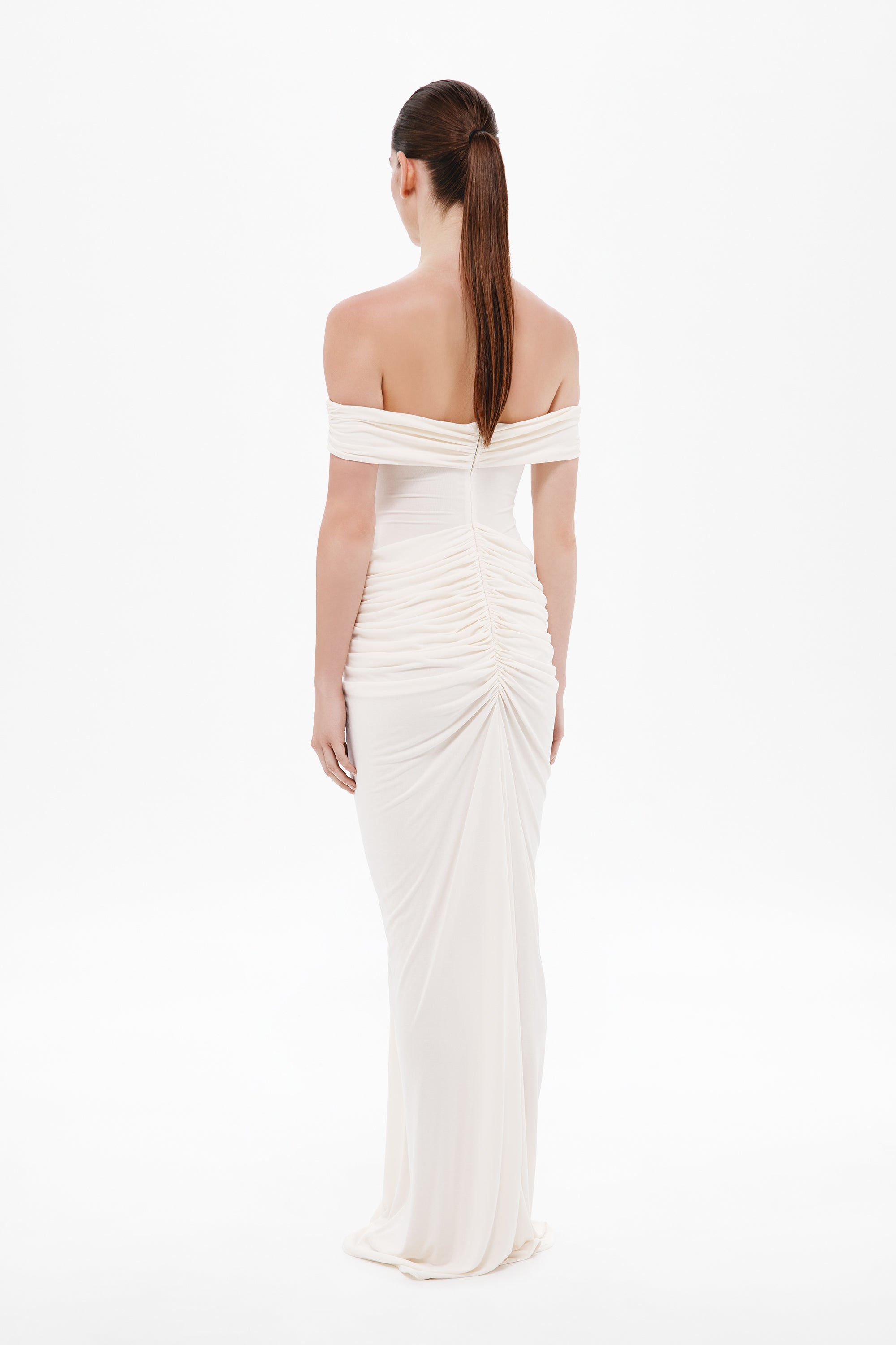 Back view of off-shoulder maxi dress in off-white with ruched center