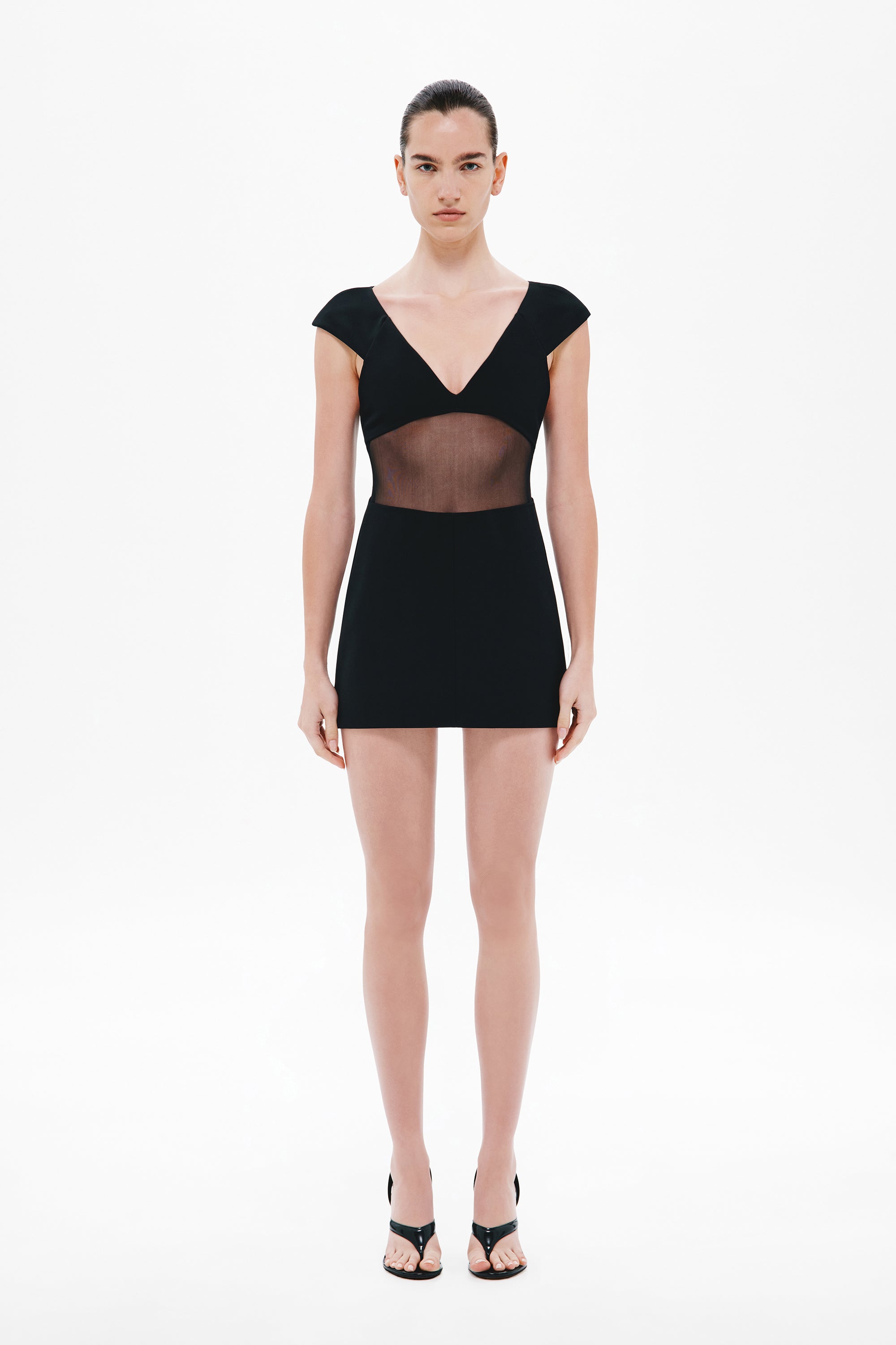 Black mini dress with V-neck, cap sleeves, sheer bonded chest/waist panels