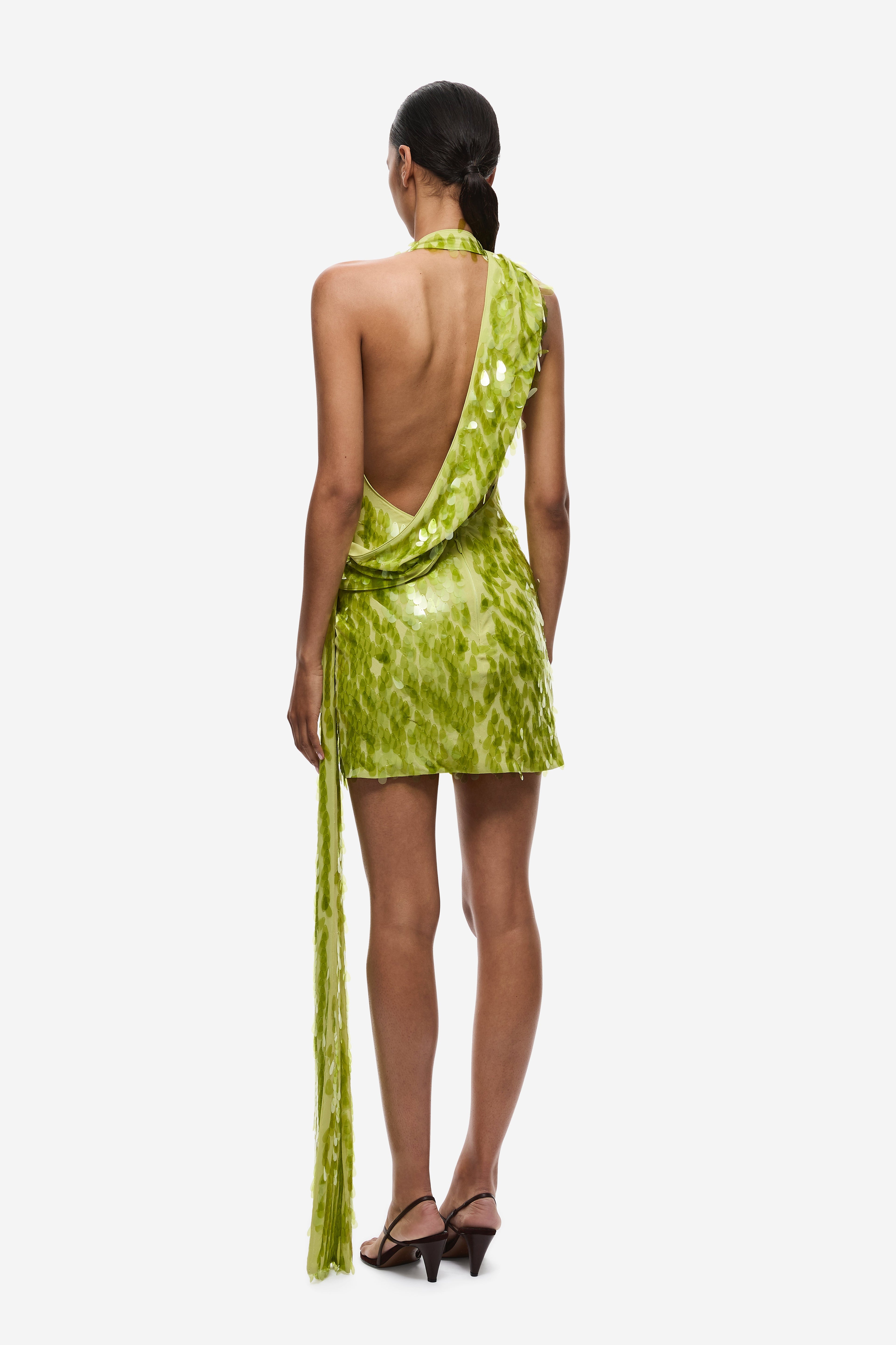 Lime green sequin mini dress, open back halter with draped sequin fringe tail.