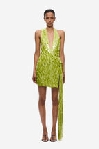 Lime green sequin mini dress with deep halter neckline and open back straps.