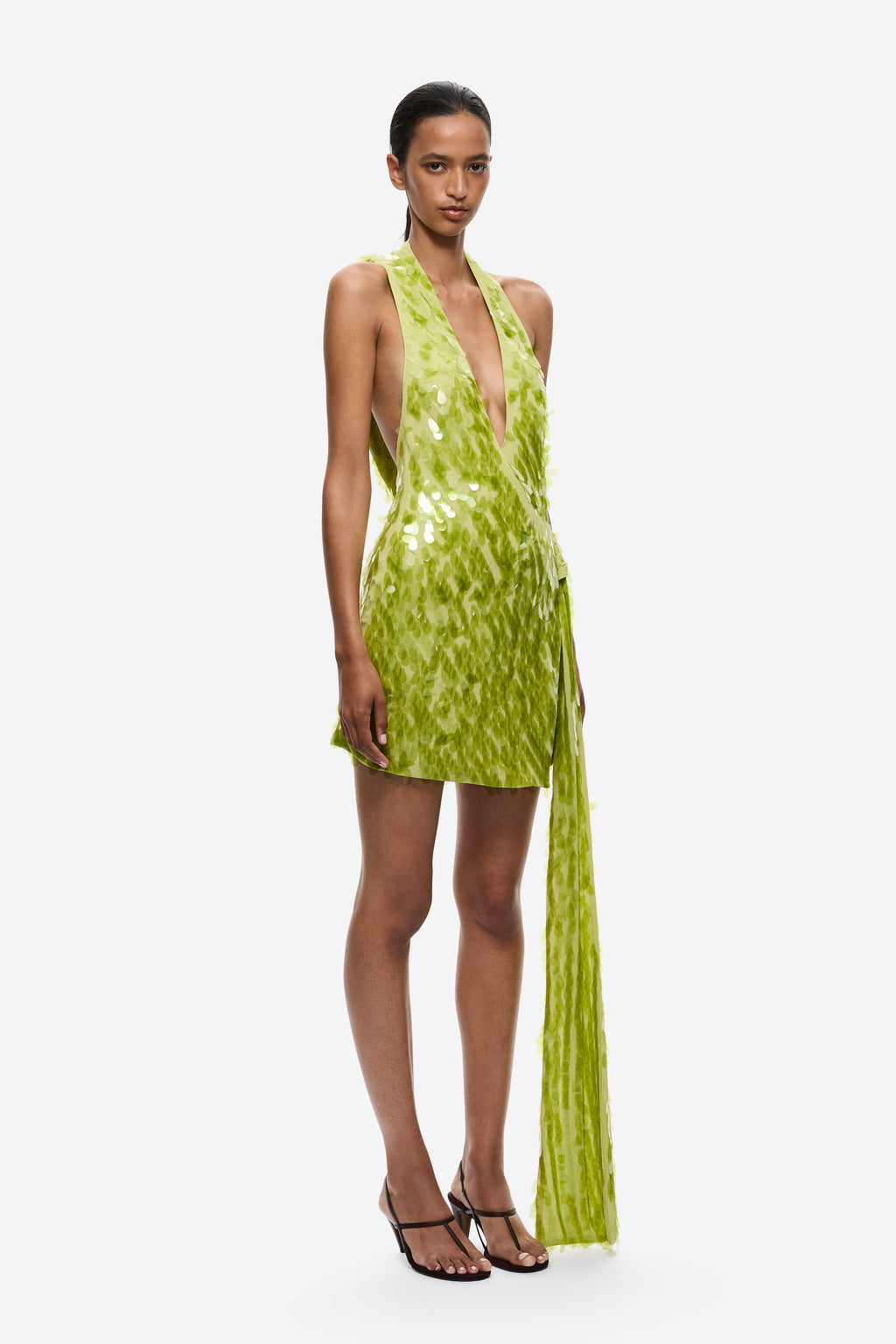 Lime green sequin mini dress with deep V halter front and long tassel fringe.