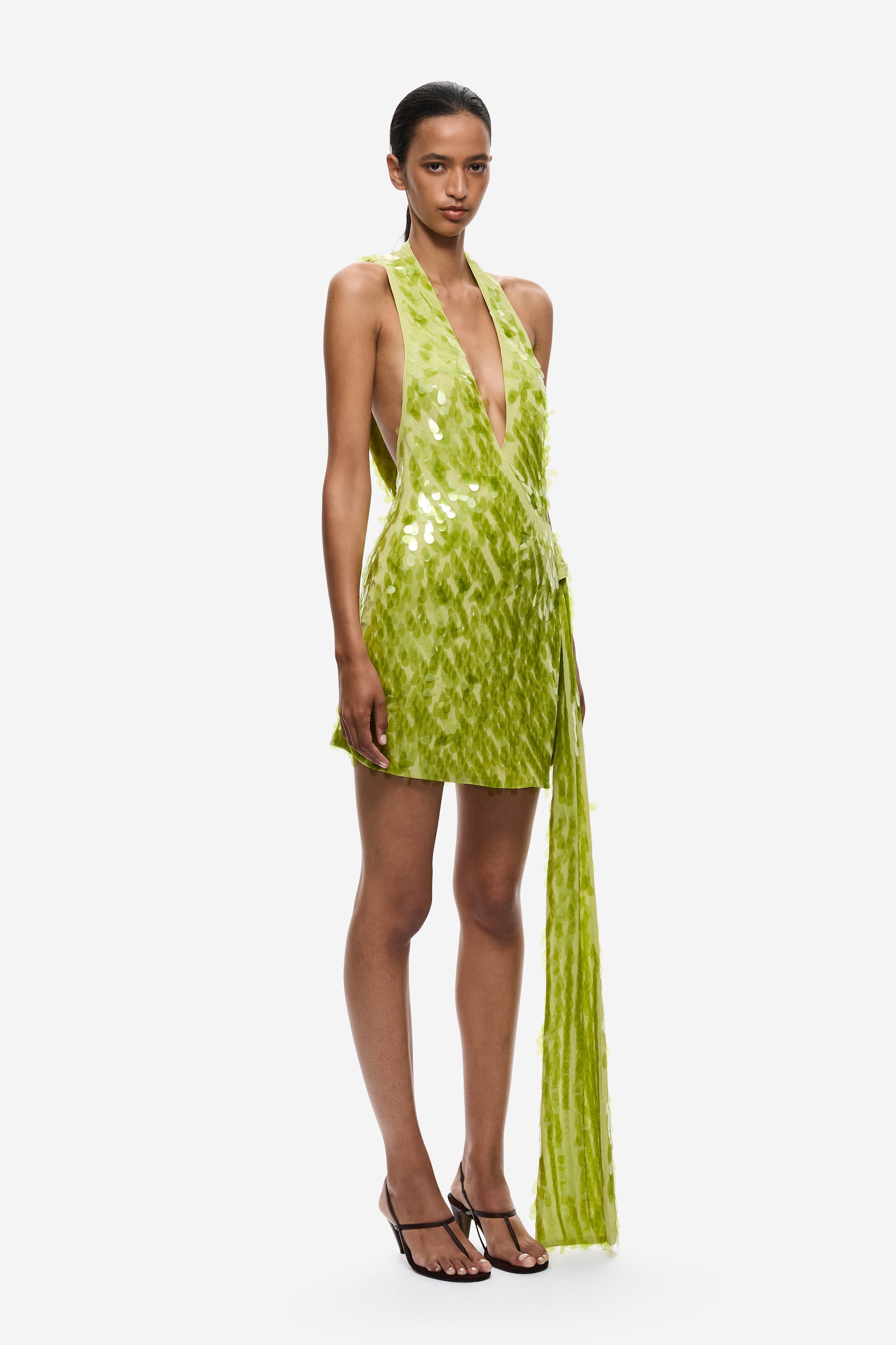 Lime green sequin mini dress with deep V halter front and long tassel fringe.
