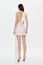 Ivory sequin mini dress with open back and flowing draped sash