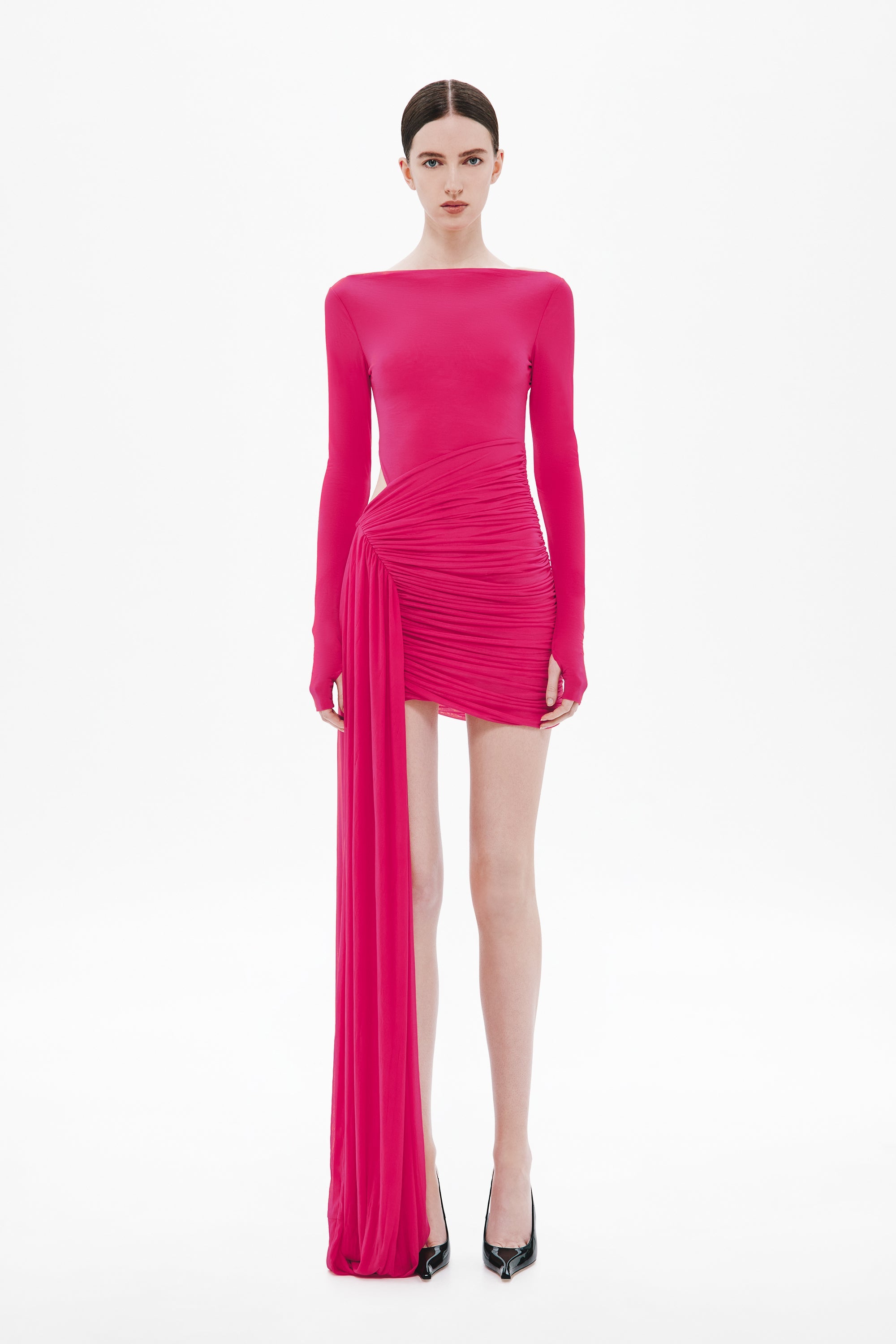 Cerise ruched mini dress with long sleeves and draped pleated skirt panel