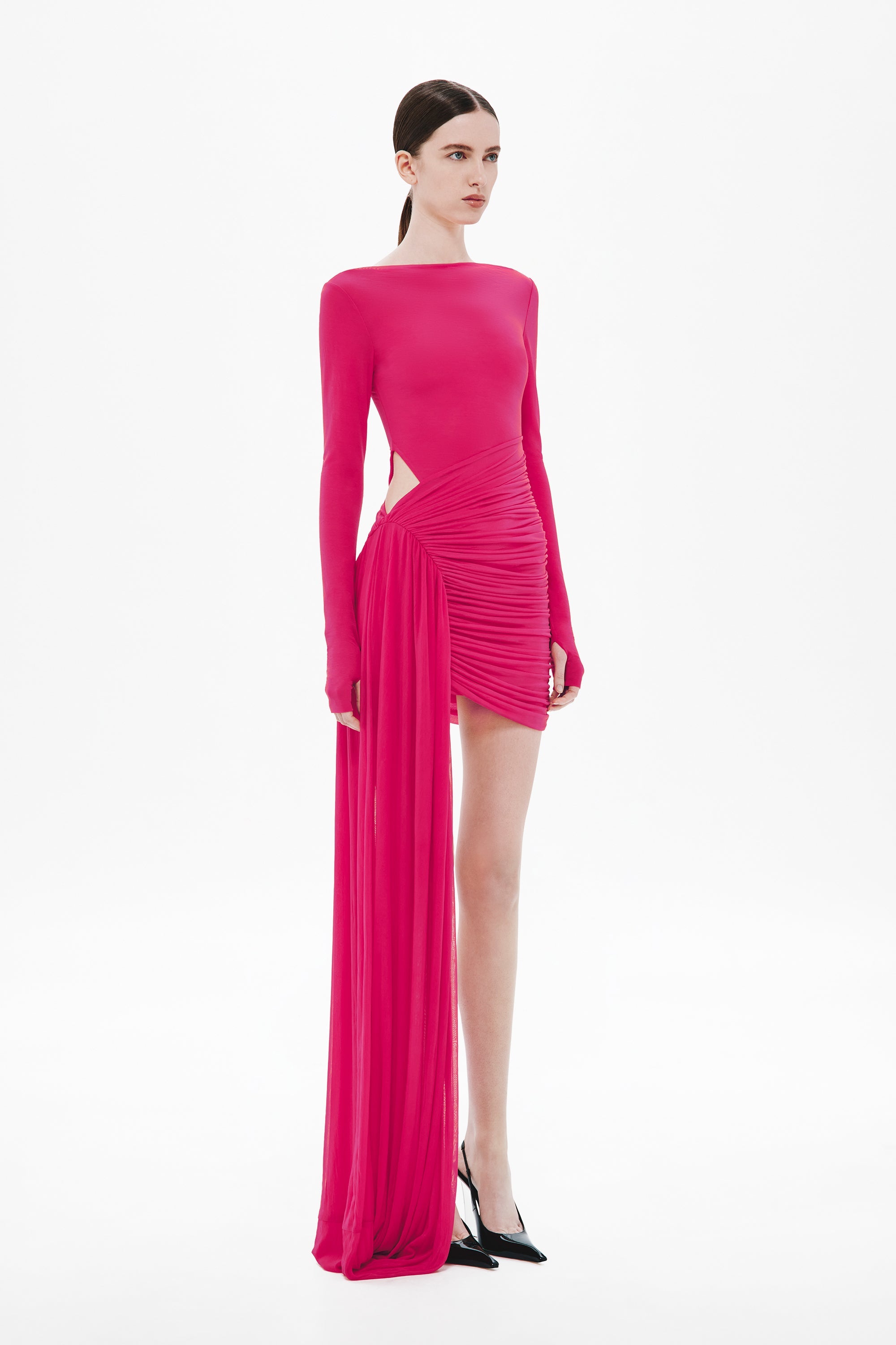 Cerise ruched mini dress with long sleeves and draped sari-style panel