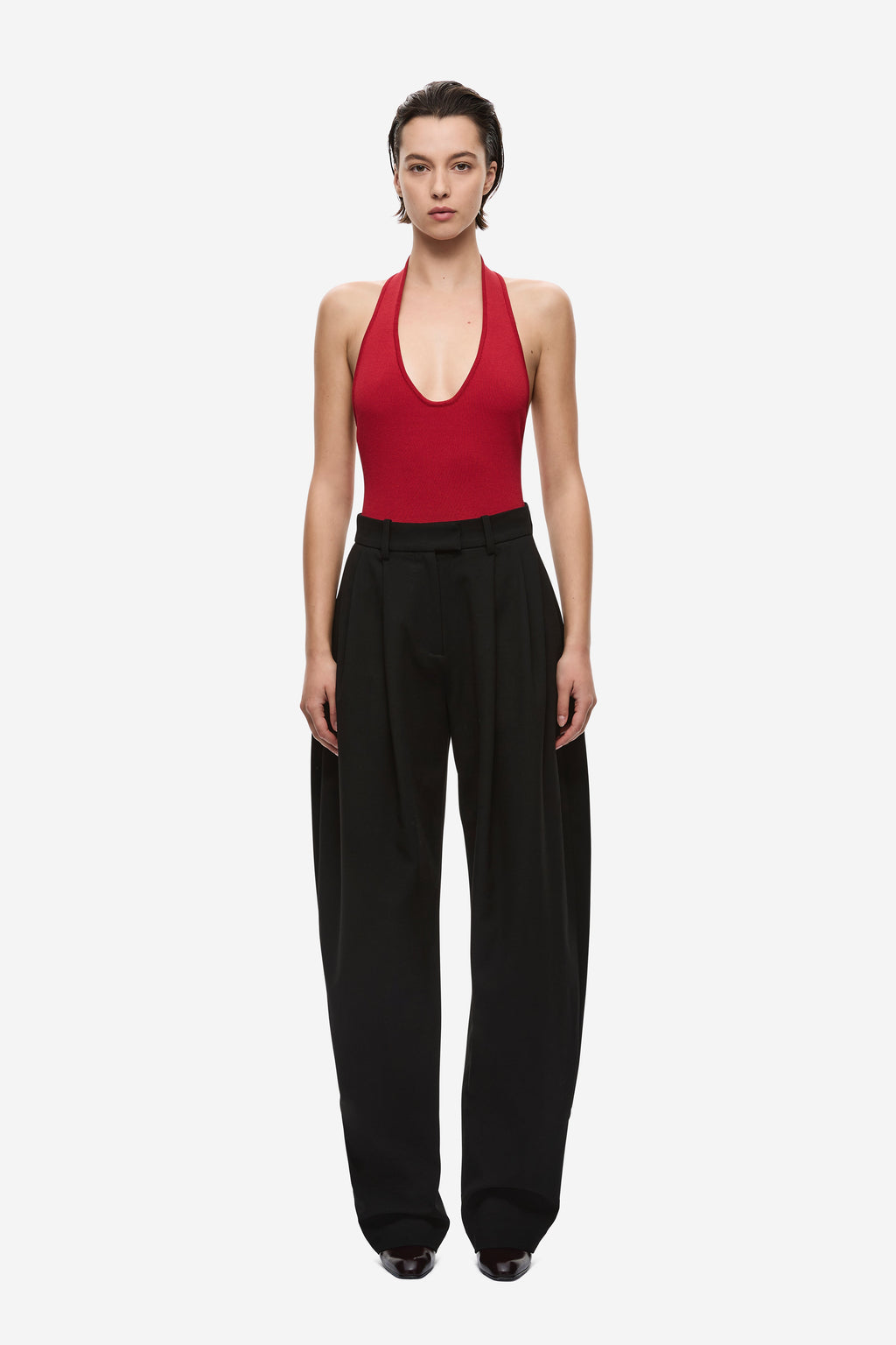 Cherry red knit bodysuit with deep scoop neckline and high-cut legs