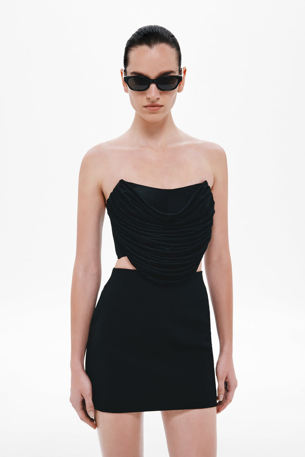 Black strapless draped bustier mini dress with side cutout
