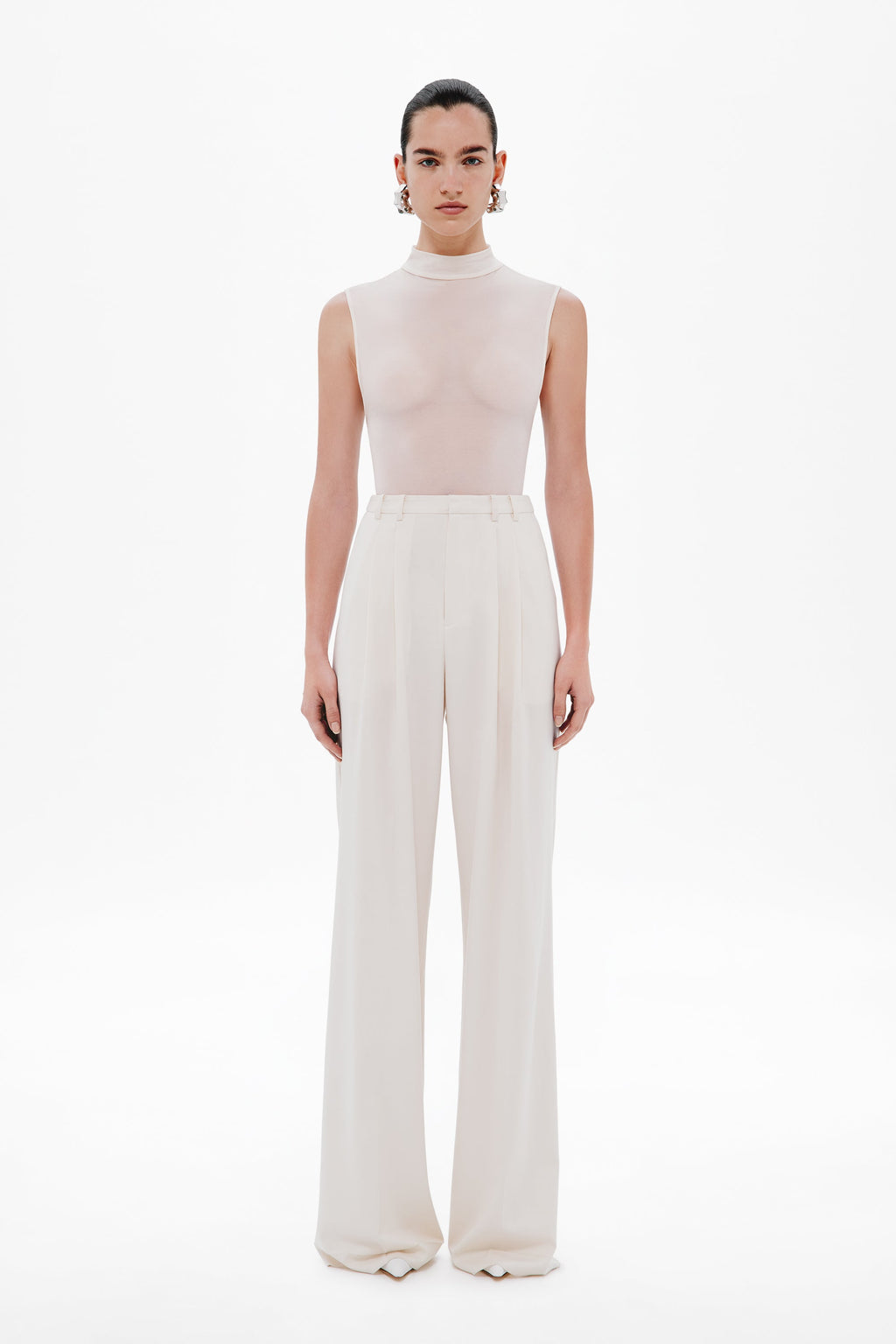 Whisper white sleeveless mock-neck bodysuit, full-length fitted silhouette