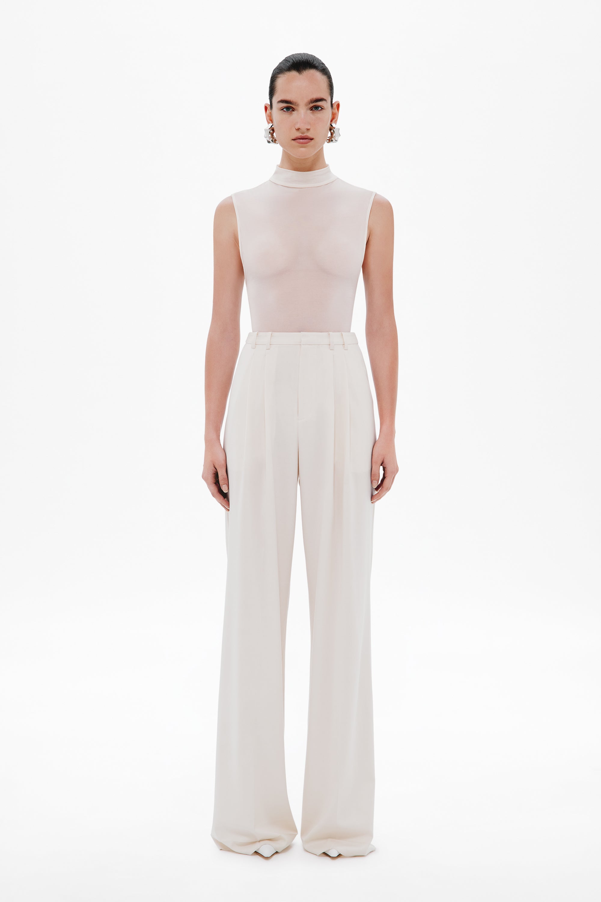 Whisper white sleeveless mock-neck bodysuit, full-length fitted silhouette