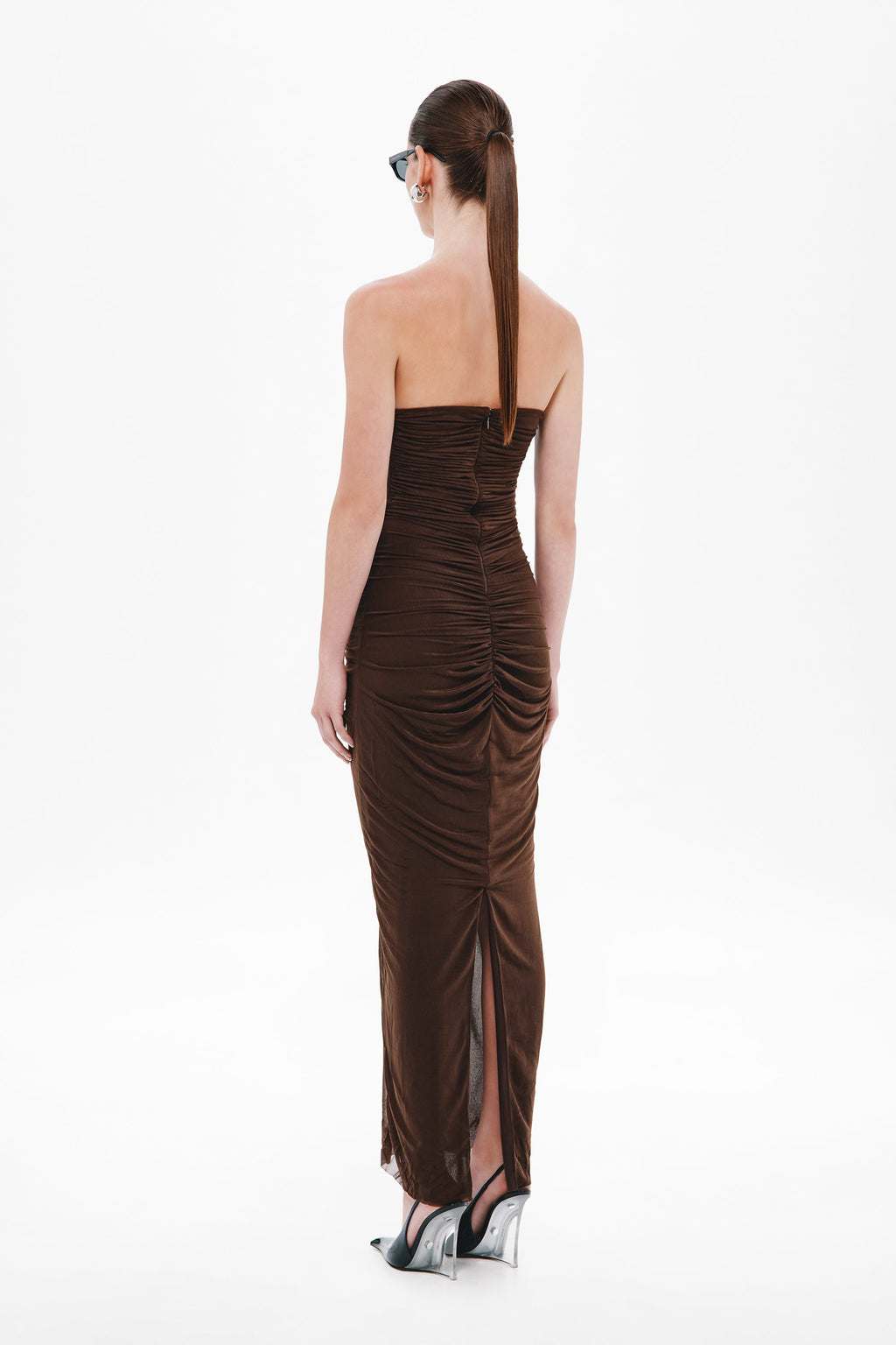 Back view of dark brown strapless ruched midi jersey dress with center seam detail
