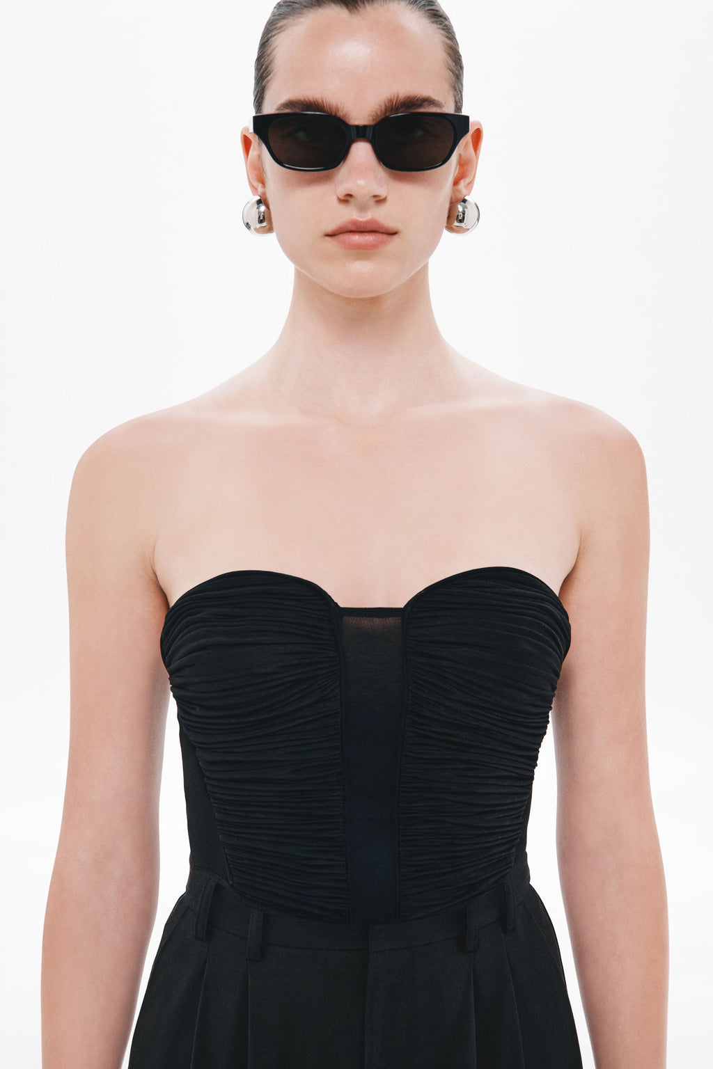 Black strapless sweetheart jersey top with ruched bust panels