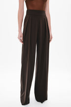 Chocolate two-pleat suiting pants, pleated waistband close-up and wide leg opening