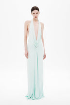 Mint green sleeveless maxi jersey dress with deep V halter front and ruched center tie