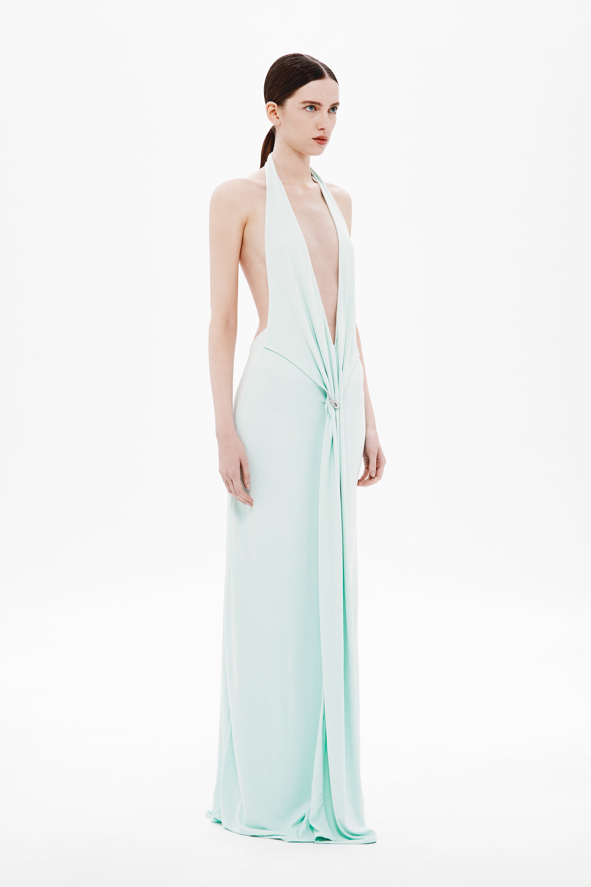 Mint green sleeveless maxi jersey dress with deep V halter neckline and open back