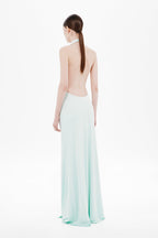 Mint green sleeveless maxi jersey dress with open back and low halter straps