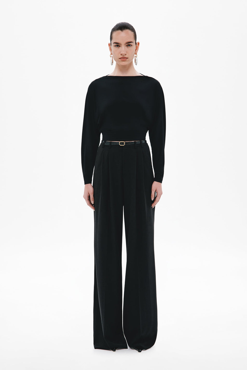 Black long-sleeve jersey top with fitted silhouette