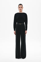 Black long-sleeve jersey top with fitted silhouette