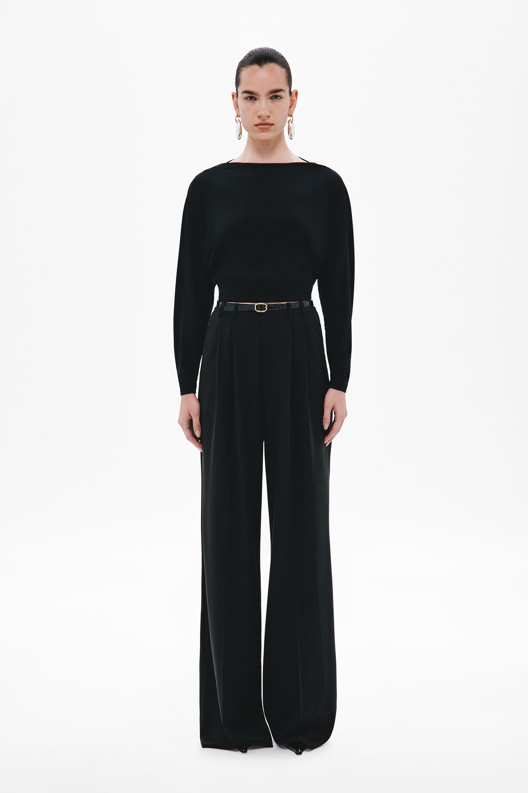 Black long-sleeve jersey top with fitted silhouette