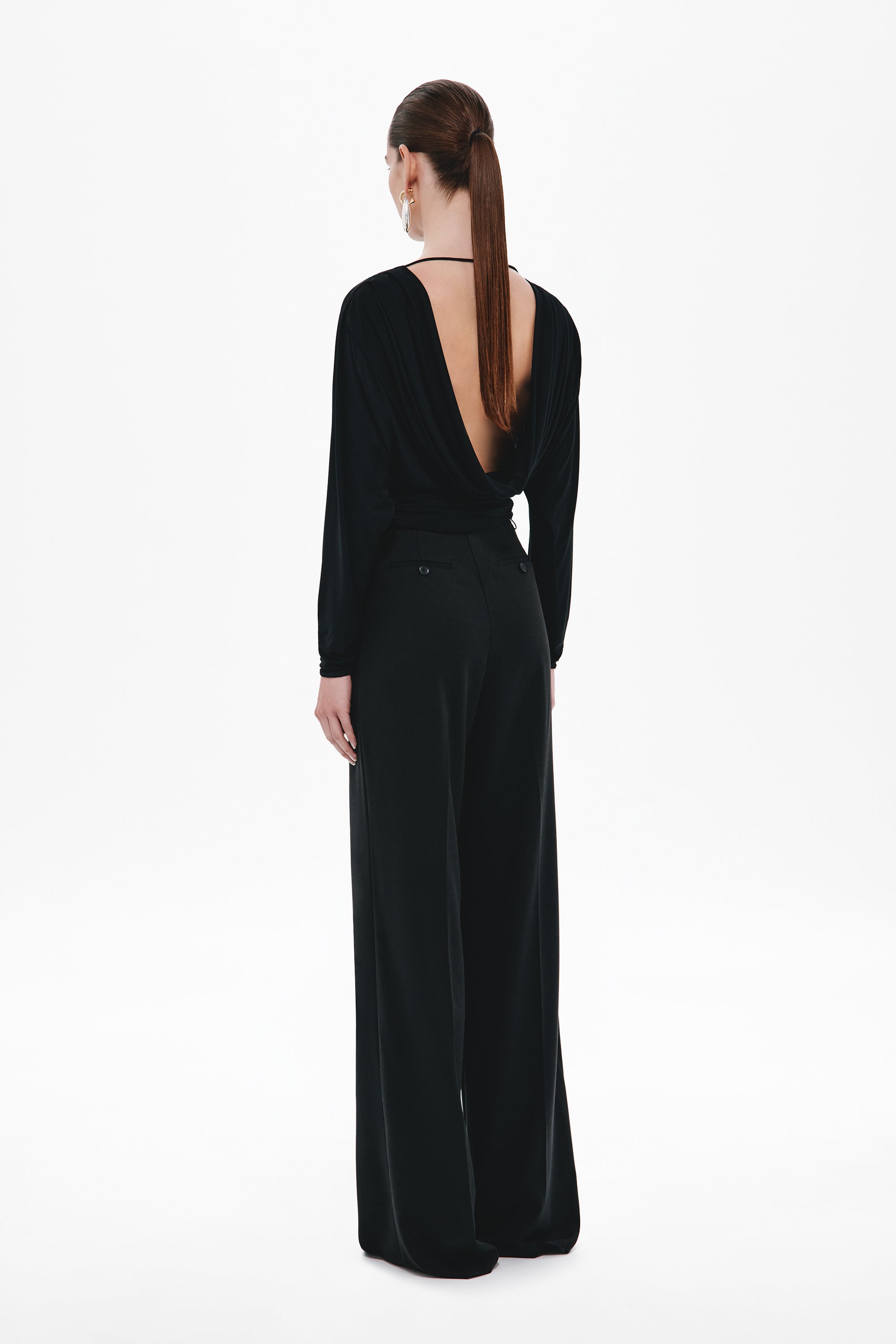 Black open-back jersey top with long sleeves